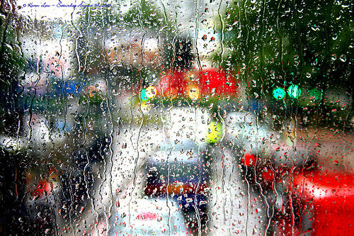 Photograph of Elephant and Castle on a rainy day in London through rain-streaked window