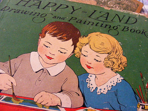 Photograph of Happy-Land book cover showing two children painting together